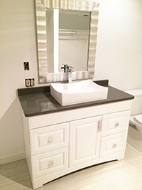 Close up of newly remodeled master bathroom vanity with vessel sink and quartz countertop in Rochester, MN