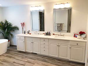 Master bathroom remodel showing beautiful grey vanity and white quartz countertop 